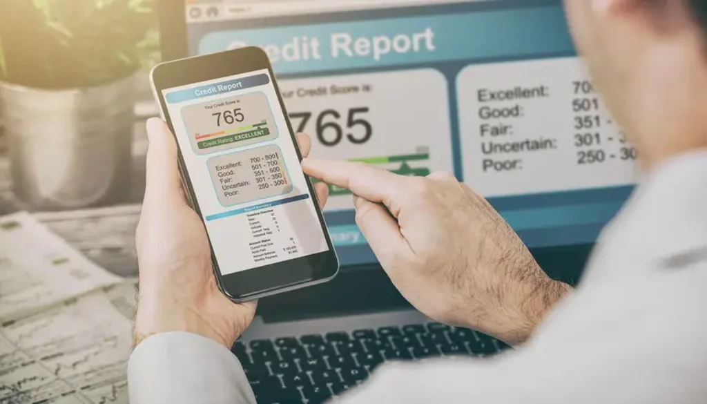 Man on phone viewing credit report