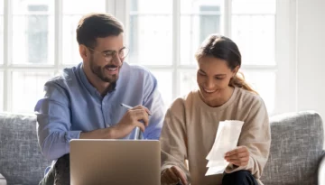 Business Man and women using a small laptop