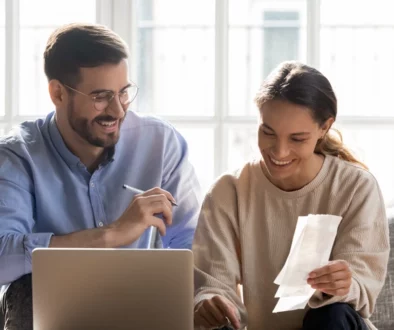 Business Man and women using a small laptop